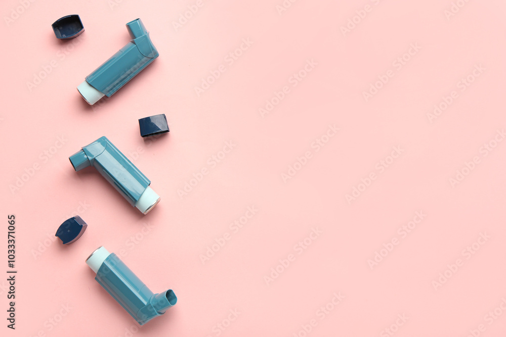 Inhalers and lids on pink background Inhalers and lids on pink background