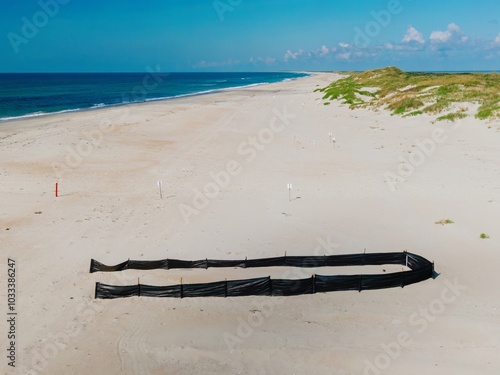 Turtle nesting ground surrounded by a protective netting on the beach on the island of Ocracoke in the Outer banks, North Carolina, United States. photo