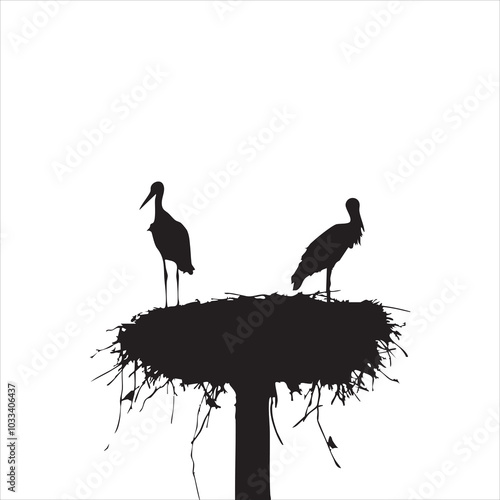 Silhouette of two storks standing in a nest against a clear white background.