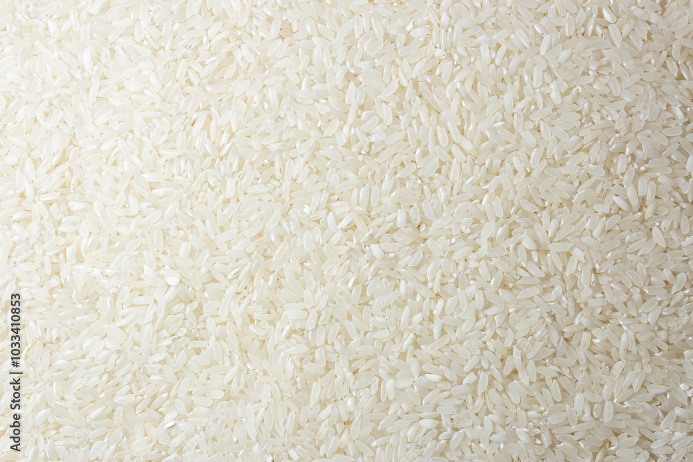 Dry Uncooked White Rice Background - Top View, Flat Lay. Scattered Raw Long Grain Rice. Asian Cuisine and Culture. Healthy Eating Ingredients. Diet Food Dry Uncooked White Rice Background - Top View, Flat Lay. Scattered Raw Long Grain Rice. Asian Cuisine and Culture. Healthy Eating Ingredients. Diet Food