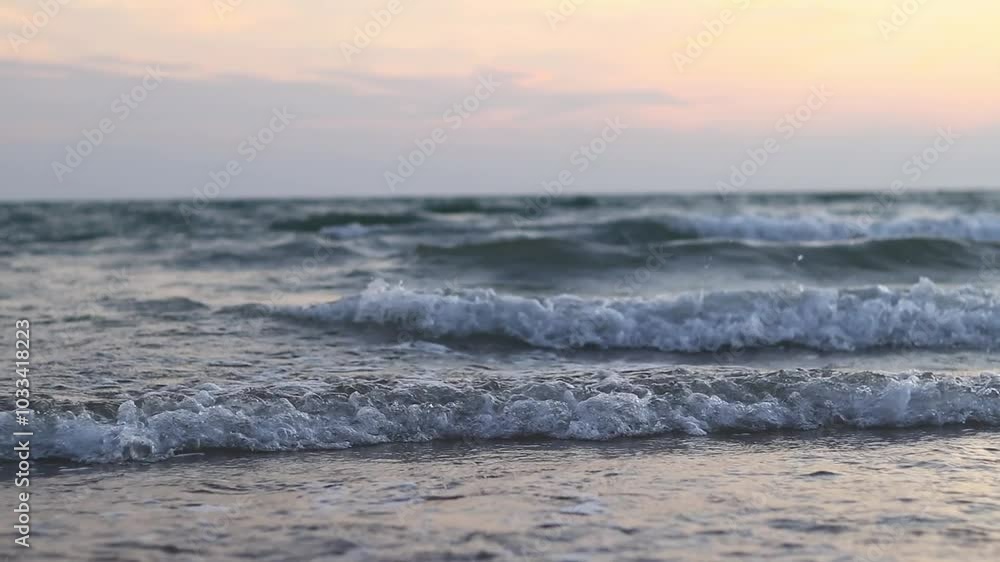 Evening view of the sea with small waves. Balearic Sea, Salou, Spain. View of the waves on the sea from a lower angle. Landscape Evening view of the sea with small waves. Balearic Sea, Salou, Spain. View of the waves on the sea from a lower angle. Landscape