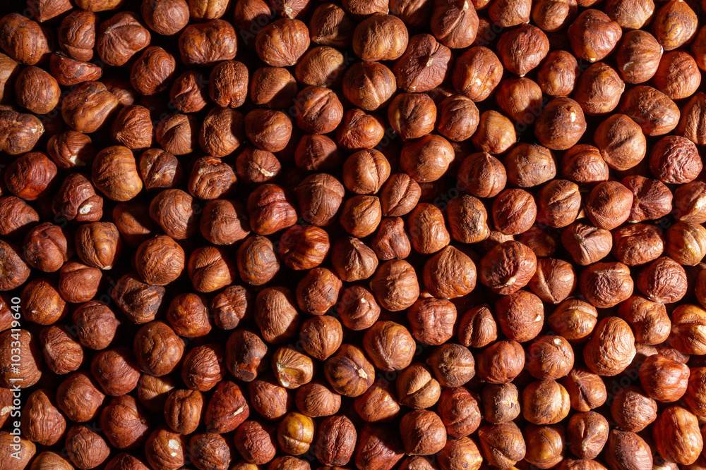 Scattered Peeled Hazelnut - Top View. Background from Hazelnuts. Natural High-Calorie Snacks Scattered Peeled Hazelnut - Top View. Background from Hazelnuts. Natural High-Calorie Snacks