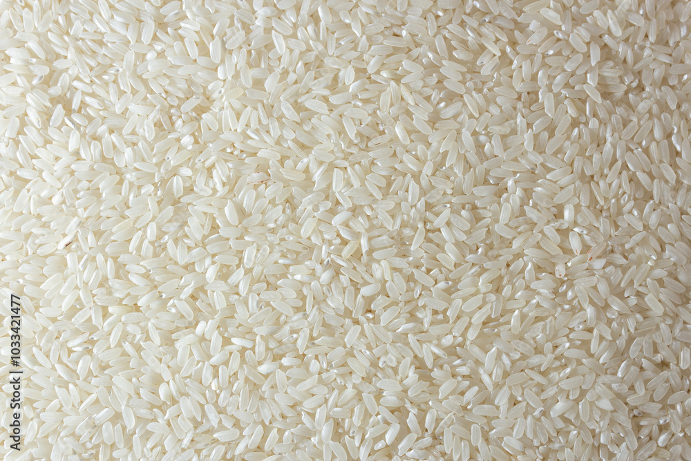 Dry Uncooked White Rice Background - Top View, Flat Lay. Scattered Raw Long Grain Rice. Asian Cuisine and Culture. Healthy Eating Ingredients. Diet Food Dry Uncooked White Rice Background - Top View, Flat Lay. Scattered Raw Long Grain Rice. Asian Cuisine and Culture. Healthy Eating Ingredients. Diet Food