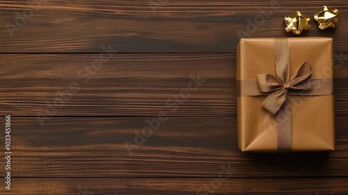 Elegant gift box on a wooden surface with ample space for text, illuminated by warm natural lighting.