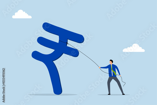 Indian investment opportunity, successful businessman investor is holding a big Indian rupee currency symbol.