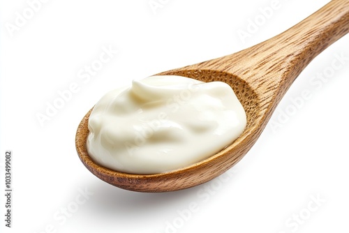sour cream in wooden spoon, mayonnaise, yogurt, isolated on white background, clipping path, full depth of field