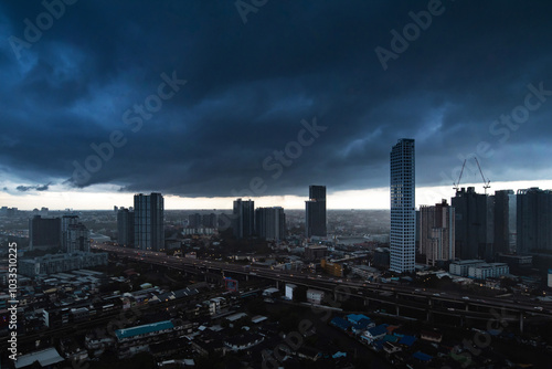 Photography Dramatic dark blue sky before a storm comes over Bangkok in Thailand at night with street lights during night with the city shining