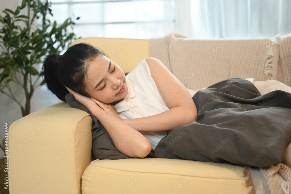 Young beautiful asian woman sleeping on couch at home Young beautiful asian woman sleeping on couch at home