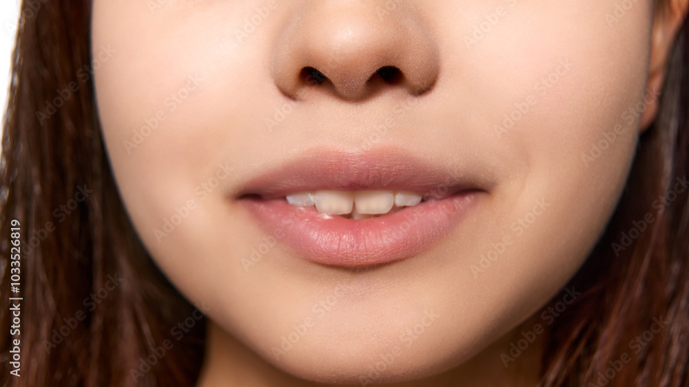 Cropped image of female face, nose and mouth. Dental care, teeth whitening, braces. Concept of natural beauty, skincare, cosmetics and cosmetology Cropped image of female face, nose and mouth. Dental care, teeth whitening, braces. Concept of natural beauty, skincare, cosmetics and cosmetology