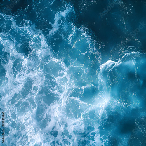 dynamic ocean waves with foamy white water, top view of blue sea in motion, abstract aquatic texture for coastal and nature-inspired designs, peaceful yet powerful ocean scene