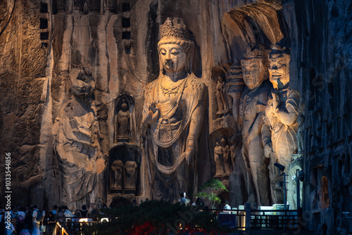 Obraz na płótnie Luoyang, China: The famous Buddha statues at night in the Luoyang Longmen Grottoes in China. The statues dates from the 7th century and the Tang dynasty in Henan province w salonie