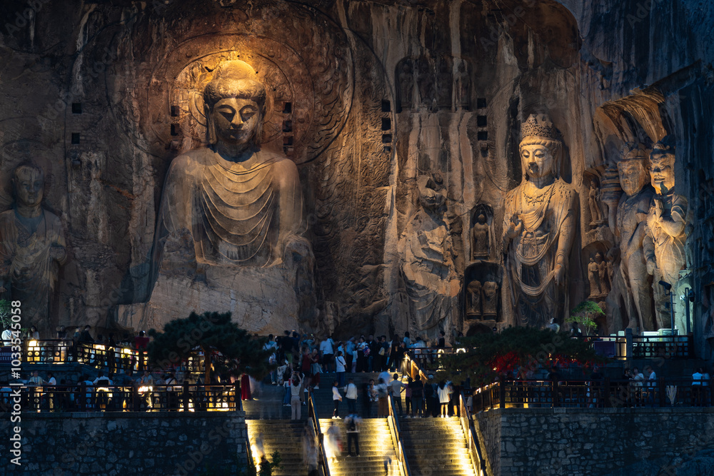 Luoyang, China: Night view of the famous Vairocana Buddha statue in the Luoyang Longmen Grottoes in China. The statues dates from the 7th century.