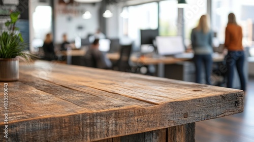 Rustic wooden table. Closeup of a rustic wooden table in a modern office setting. The table's natural wood grain and texture create a warm and inviting atmosphere.