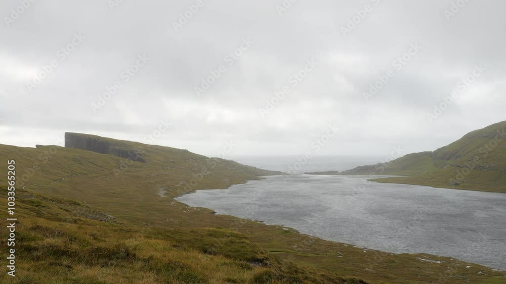 Panorama of Lake Sorvagsvatn on cloudy day, ocean in background, Faroe Islands. Static Panorama of Lake Sorvagsvatn on cloudy day, ocean in background, Faroe Islands. Static