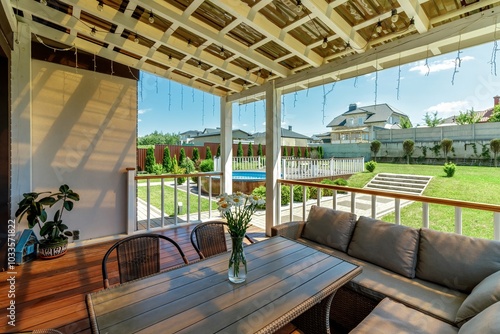Canvastavla Serene Outdoor Patio with Comfortable Seating and Greenery