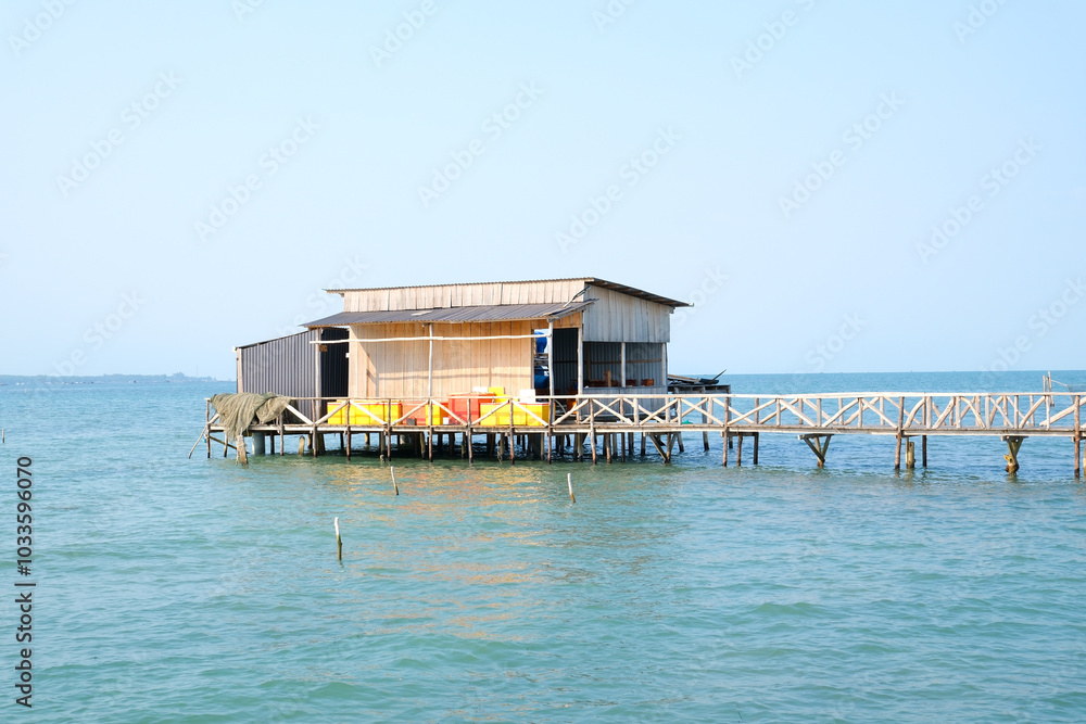 fishing village indian ocean on phu quoc island beautiful water surface fish fish farming wooden bridge house against the backdrop of extraordinary wild nature fishing village indian ocean on phu quoc island beautiful water surface fish fish farming wooden bridge house against the backdrop of extraordinary wild nature