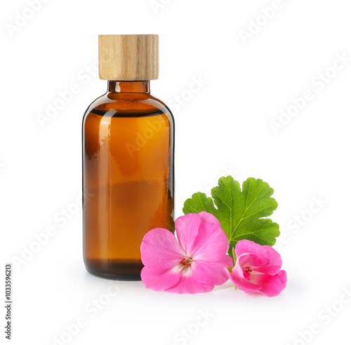 Geranium essential oil in bottle and beautiful flowers isolated on white