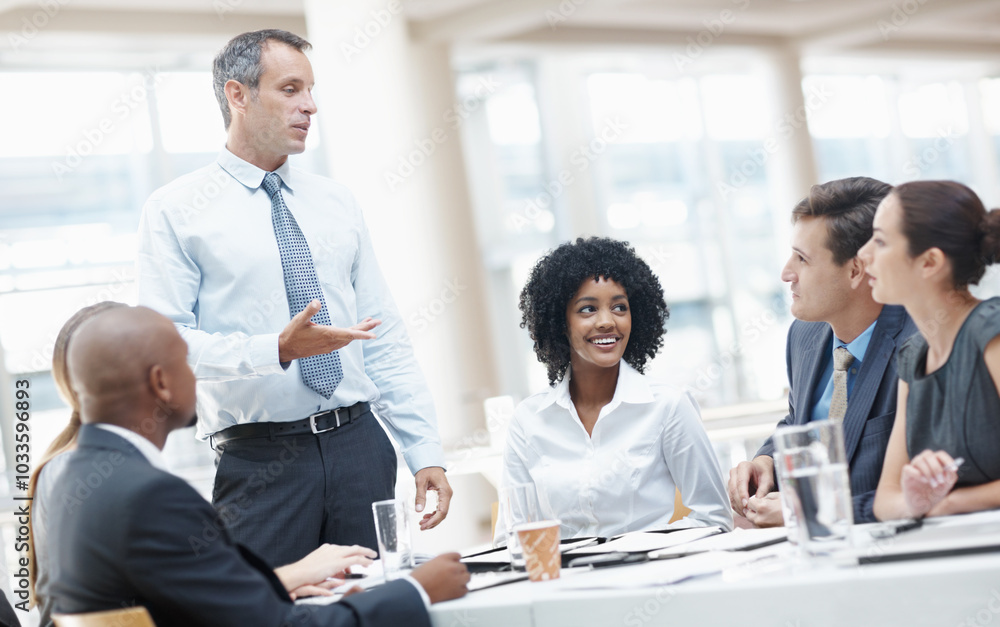 Businessman, presentation and brainstorming with team in meeting for corporate plan or project at office. Man, executive or speaker talking to group of employees for business campaign or development Businessman, presentation and brainstorming with team in meeting for corporate plan or project at office. Man, executive or speaker talking to group of employees for business campaign or development