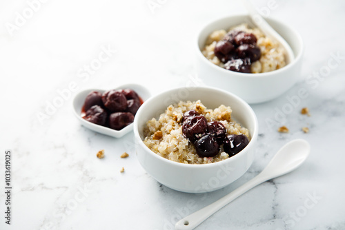 Homemade pudding with warm cherries and coconut photo