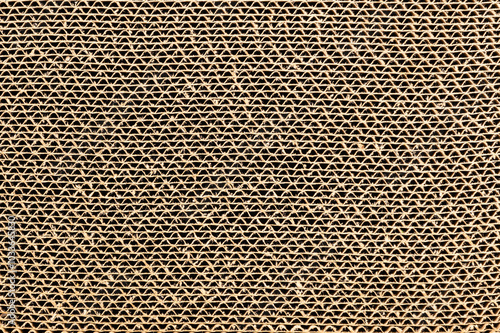 Closeup view of corrugated cardboard use as a scratching post for cat.