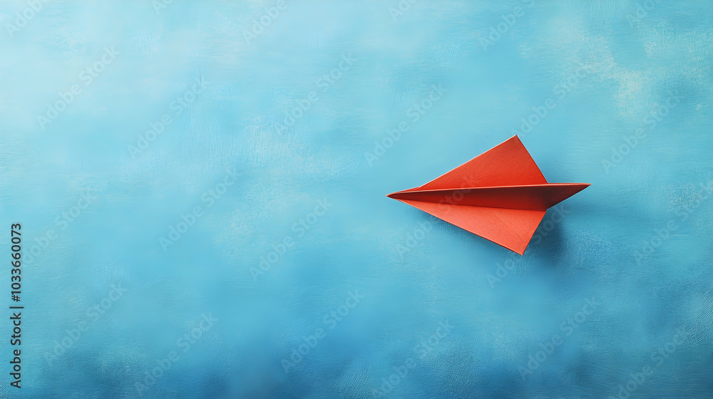 A red paper airplane flying in the middle of a blue background, standing out from the rest - A red paper airplane flying in the middle of a blue background, standing out from the rest -
