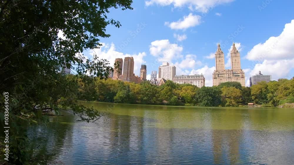 Central Park lake under a cloudy sky. New York, USA