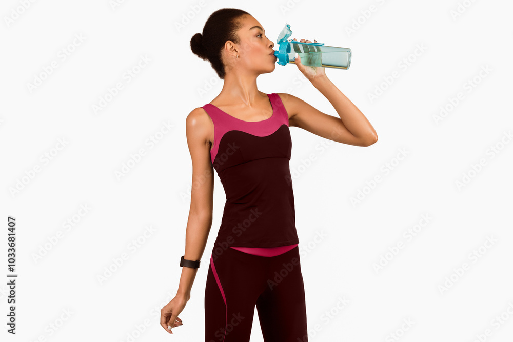 Sporty Lifestyle. Afro Lady Drinking Water From Bottle Standing Over White Background. Studio Shot, Isolated Sporty Lifestyle. Afro Lady Drinking Water From Bottle Standing Over White Background. Studio Shot, Isolated
