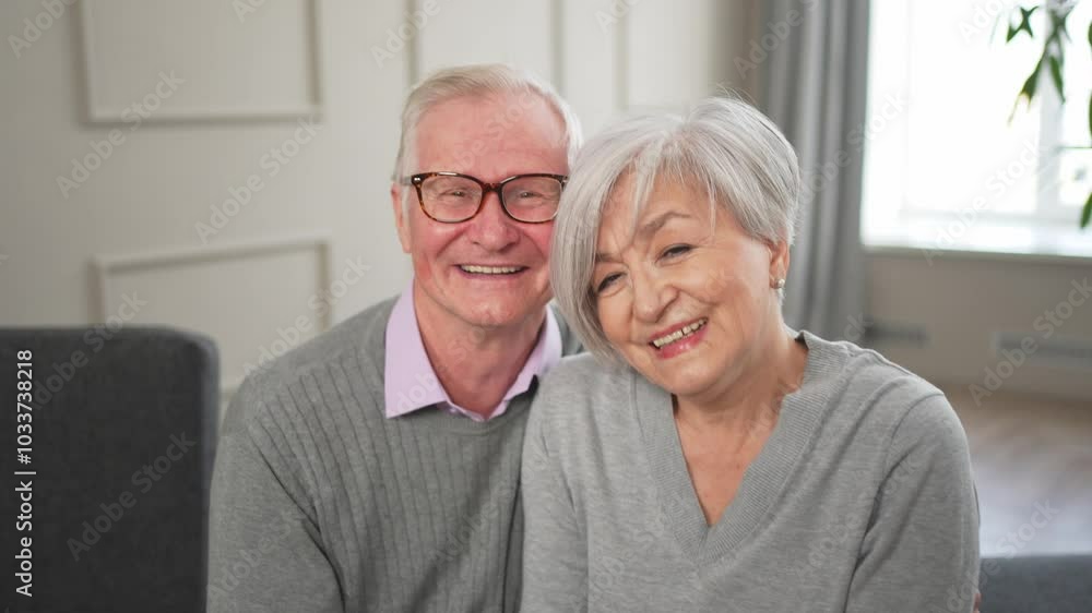 Senior adult mature couple hugging at home. Mid age old husband and wife embracing with tenderness love enjoying sweet bonding wellbeing. Grandmother grandfather together. Family moment love and care Senior adult mature couple hugging at home. Mid age old husband and wife embracing with tenderness love enjoying sweet bonding wellbeing. Grandmother grandfather together. Family moment love and care