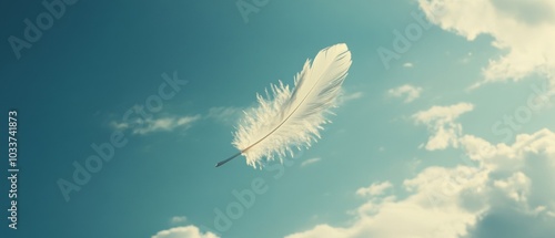 A white feather is flying in the sky photo