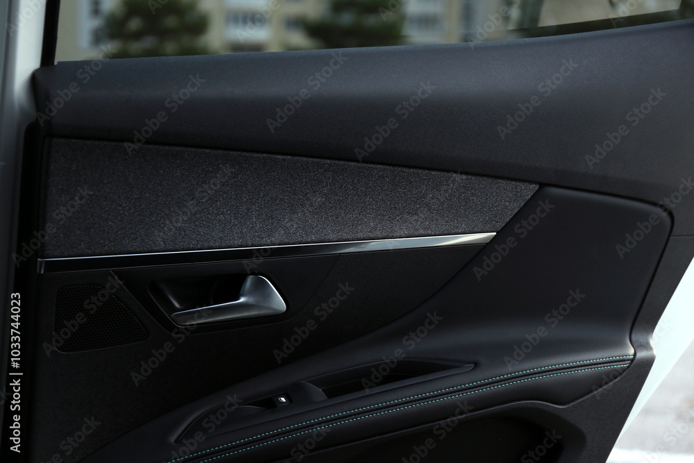 Closeup view of black car door inside modern automobile Closeup view of black car door inside modern automobile