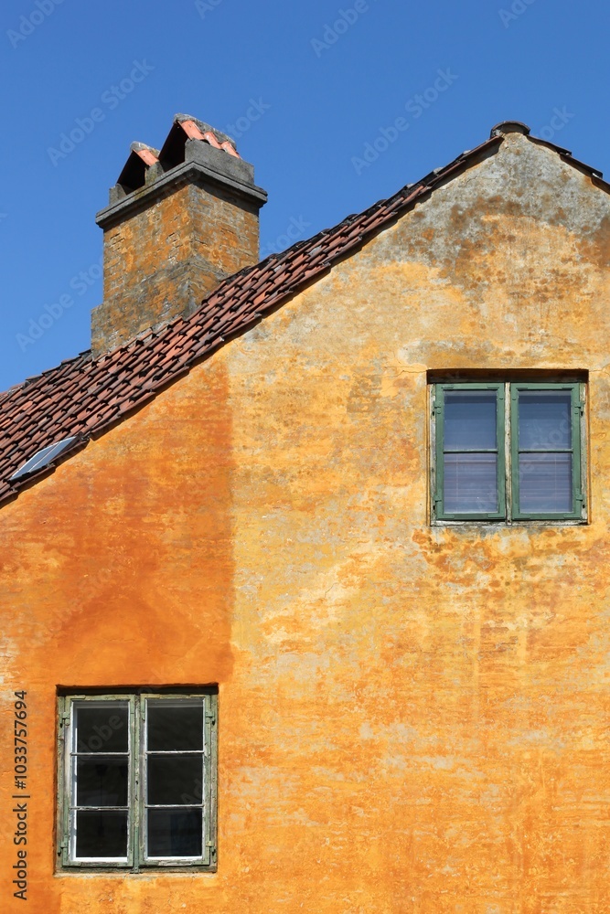 Old orange house of Nyboder district in Copenhagen, Denmark Old orange house of Nyboder district in Copenhagen, Denmark