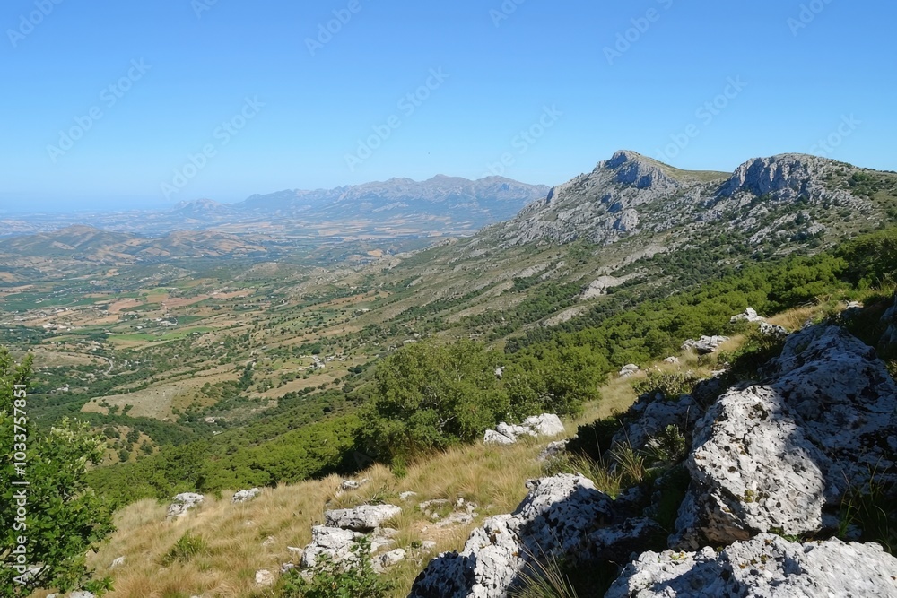 Stunning mountainscape view of lush valleys under a clear blue sky in the daytime Stunning mountainscape view of lush valleys under a clear blue sky in the daytime