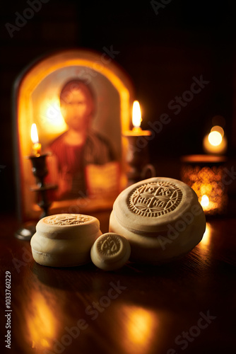 church prisphors with candles and an icon photo