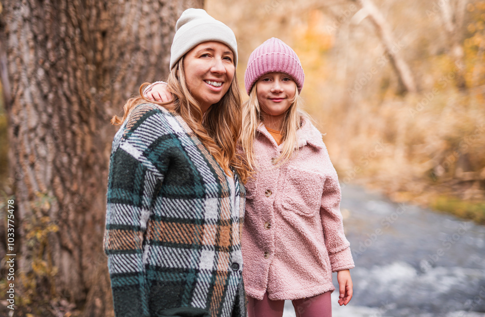 Joyful mom and his little child girl. mother and child have fun outdoors at autumn park. Joyful mom and his little child girl. mother and child have fun outdoors at autumn park.