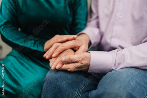 Old couple hands. Senior couple in love holding hands. Mid age old husband wife touching hands with tenderness love enjoying wellbeing. Grandmother grandfather together. Family moment love and care