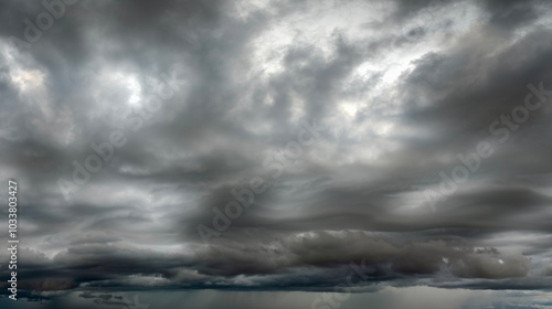 Stormy cumulonimbus clouds forming before thunderstorm on dark sky. Moving and changing cloudscape weather