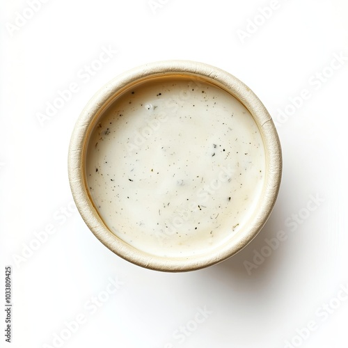Top view of a paper cup with ranch dressing isolated on white background