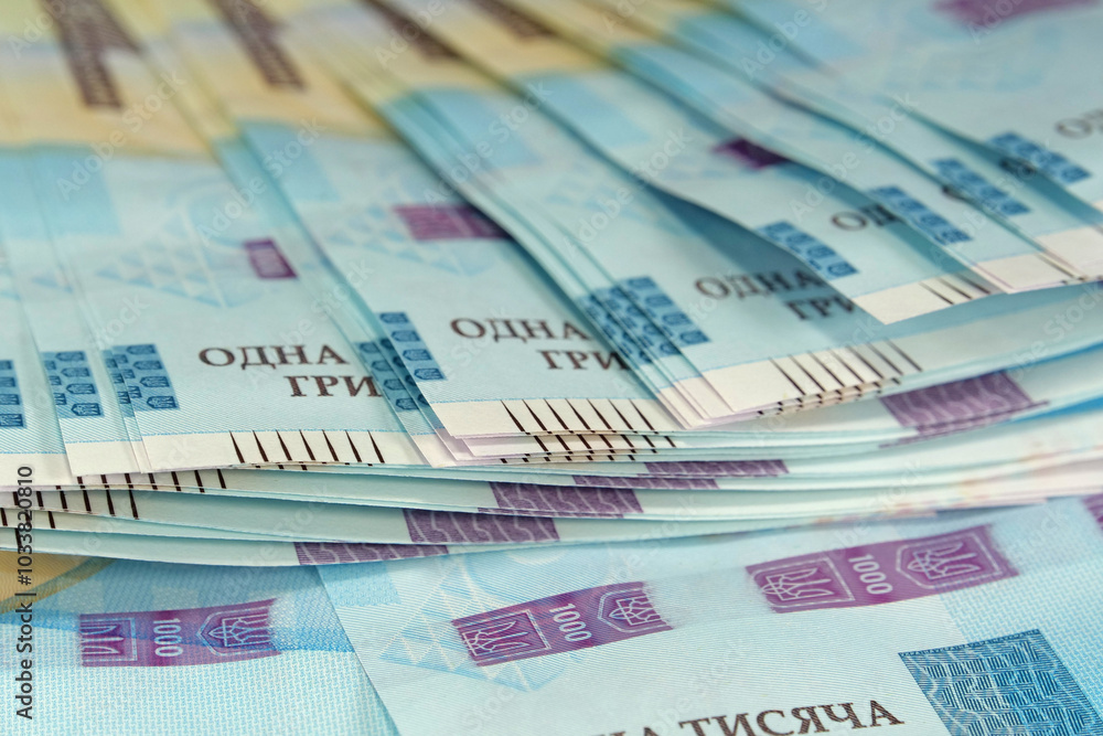 Fototapeta premium Banknotes 1000 Hryvnia. Real Ukrainian paper money of blue yellow color