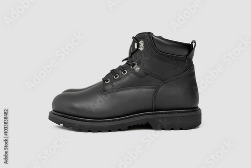 Black leather boots on white background. Fashion