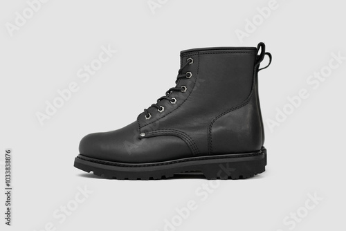 Black leather boots on white background. Fashion 