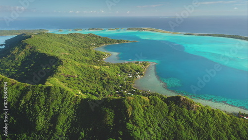 Aerial view Bora Bora green mountain island, turquoise lagoon and coral reef. French Polynesia stunning tropical paradise, perfect exotic summer travel luxury vacation. Wild nature drone background