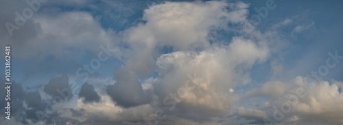 Russia. The South of Western Siberia. Panorama of the evening summer sky with multicolored clouds over the fields of Kuznetsk Alatau.