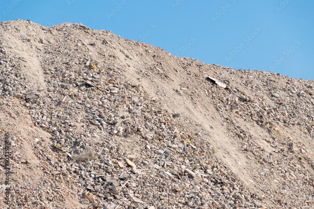 A pile of construction waste on a construction site. A pile of construction waste on a construction site.