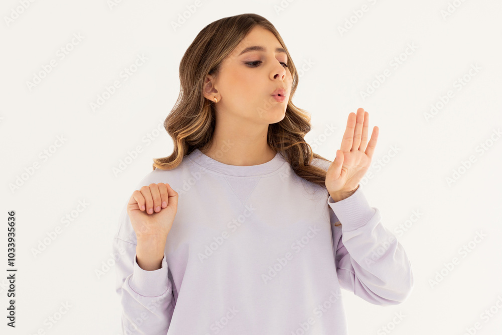 Young caucasian woman looking at manicure on white background Young caucasian woman looking at manicure on white background