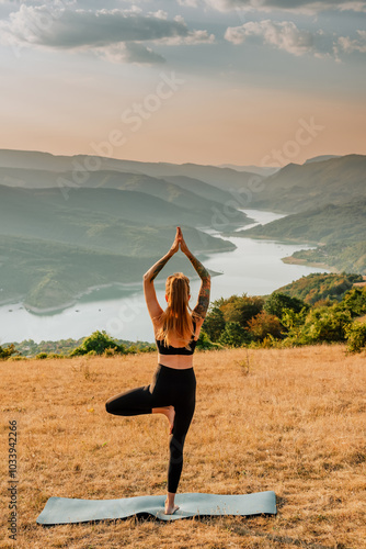 Obraz na płótnie Woman Doing Yoga on Mountain River Background w salonie