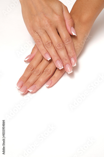 Beautiful feminine hands with French manicure.