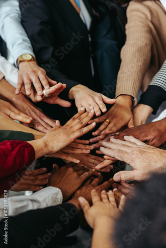 Fotografie Multiethnic teamwork showing unity with diverse hands working together in a grou