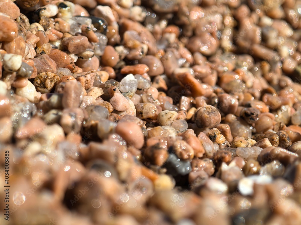 Detailed Close-up of Beach Sand Texture, Highlighting Intricate Shapes, Rich Color Variations, Perfect for Graphic Design Projects and Artistic Creations. Detailed Close-up of Beach Sand Texture, Highlighting Intricate Shapes, Rich Color Variations, Perfect for Graphic Design Projects and Artistic Creations.