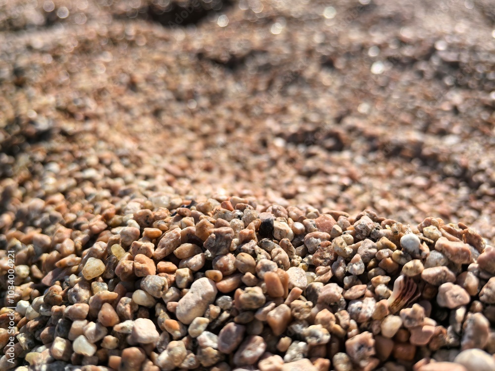 Detailed Close-up of Beach Sand Texture, Highlighting Intricate Shapes, Rich Color Variations, Perfect for Graphic Design Projects and Artistic Creations. Detailed Close-up of Beach Sand Texture, Highlighting Intricate Shapes, Rich Color Variations, Perfect for Graphic Design Projects and Artistic Creations.
