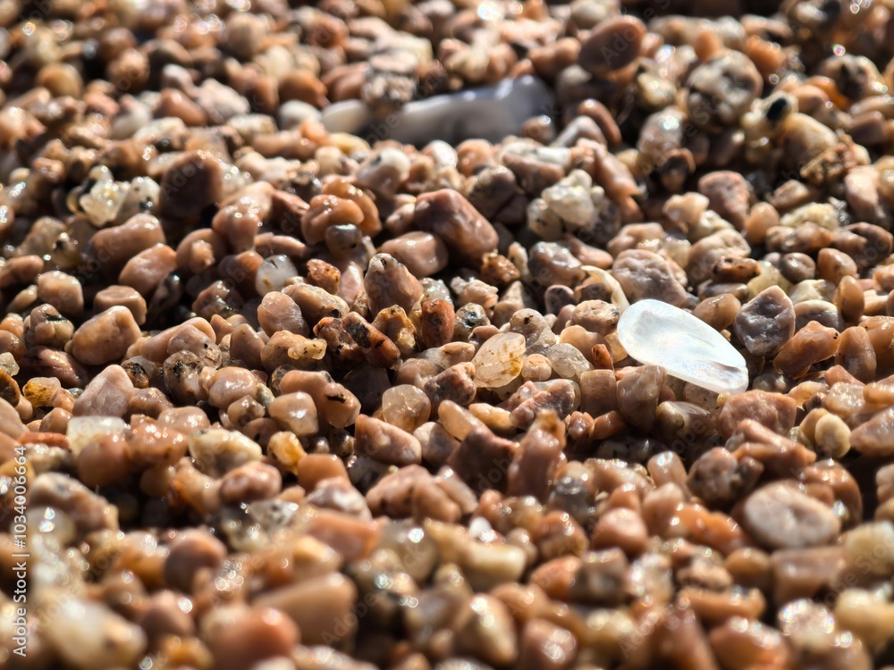 Detailed Close-up of Beach Sand Texture, Highlighting Intricate Shapes, Rich Color Variations, Perfect for Graphic Design Projects and Artistic Creations. Detailed Close-up of Beach Sand Texture, Highlighting Intricate Shapes, Rich Color Variations, Perfect for Graphic Design Projects and Artistic Creations.